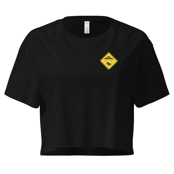 Black crop top with a yellow and black graphic on a white background