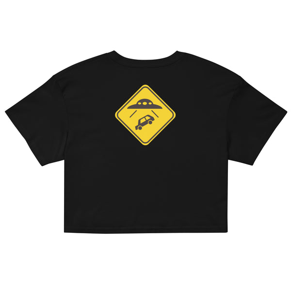 Black crop top with a yellow warning sign graphic on a white background