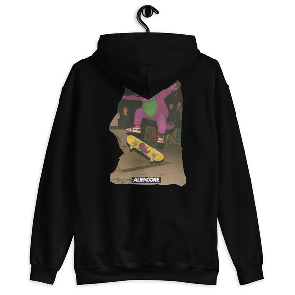 Black hoodie with a graphic of a person skateboarding on the back, hanging on a white background.
