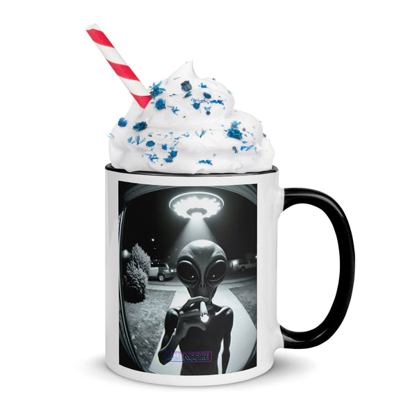 Mug with alien design and whipped cream on a white background