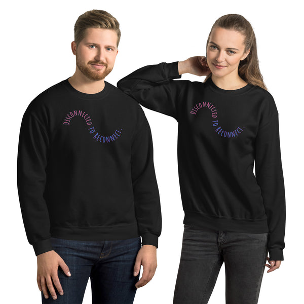 Two people wearing black sweatshirts with a circular design on a white background