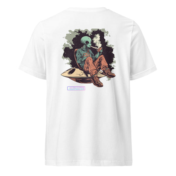 White t-shirt with a graphic of an alien on a UFO, sitting and smoking a cigarette, on a white background.