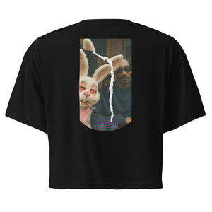 Black t-shirt with a graphic of a person and rabbit on the back, on a white background