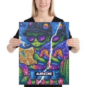 Person holding a colorful poster of an alien reading a book with Aliencore branding.