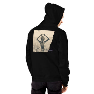 Person wearing a black hoodie with a graphic design on the back against a gray background