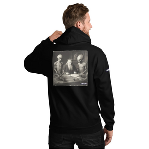 Person wearing a black hoodie with a graphic design on the back, standing against a white background.