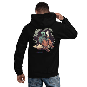 Person wearing a black hoodie with a graphic design on the back, standing against a white background