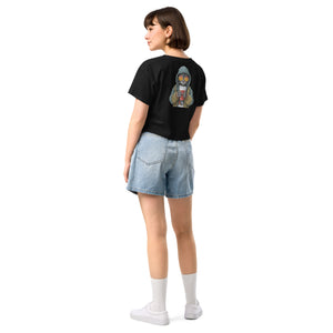 Person wearing a black t-shirt with a graphic design on the back, paired with denim shorts and white socks.