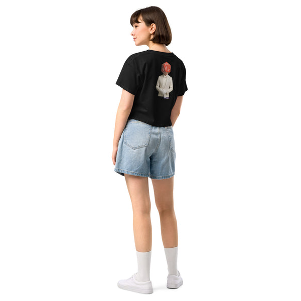 Person wearing a black t-shirt with a graphic design on the back, standing against a white background