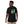 Person wearing a black t-shirt with an alien and astronaut graphic on the back.