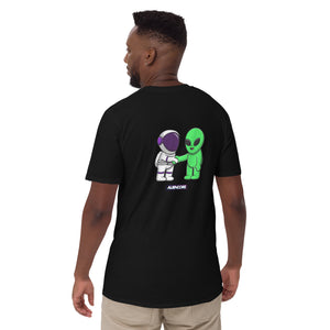 Person wearing a black t-shirt with an alien and astronaut graphic on the back.