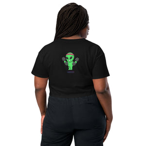 Person wearing a black t-shirt with an alien graphic on the back, standing against a white background