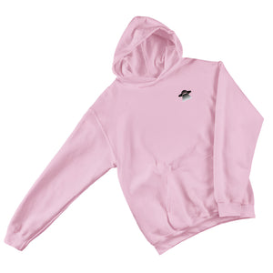 Pink hoodie with a small black logo on a gray surface with jeans, shoes, and accessories.