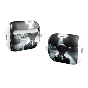 Silver AirPod cases with alien design on a white background