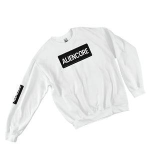 White sweatshirt with 'ALIENCORE' logo on a gray surface with plants and accessories.
