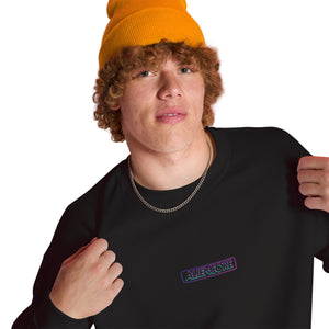 Person wearing a black sweatshirt with a logo, standing against a gradient background