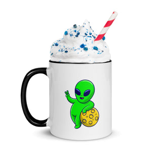 Mug with a cartoon alien design on a white background